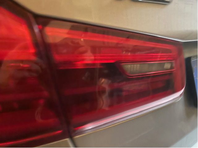 Tail light hatch left
